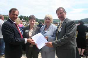 Pictured from L-R � Mansel Raymond, Chairman of NFU Cymru�s Milk Board; Rhian Connick, Chief Executive of the WI in Wales, Marylyn Haines Evans, Chairman of the WI in Wales and Dai Davies, NFU Cymru President. 