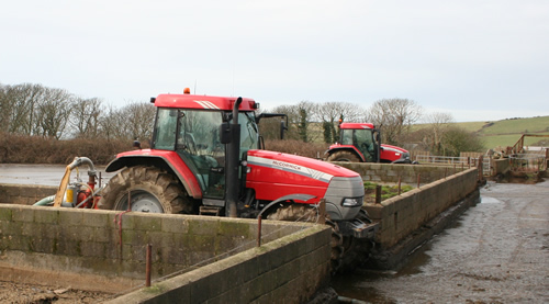 six-cylinder McCormick MTX135 (nearest) and an MC130 at work on slurry pump and slurry stirrer duties.