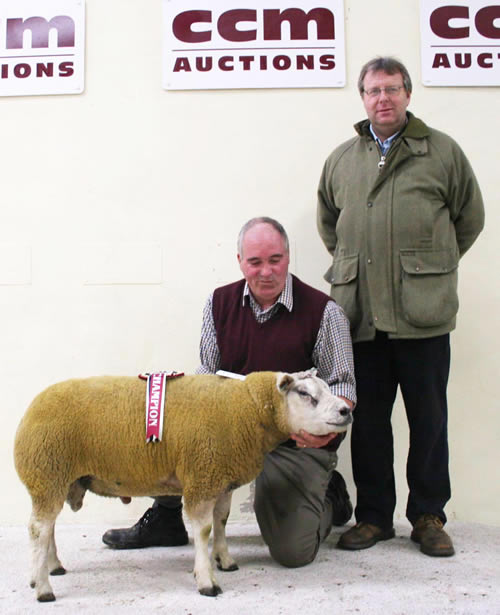 Thomas Hunter with his Skipton multi-breed Beltex champion, joined by judge Martin Preston, Bingley.