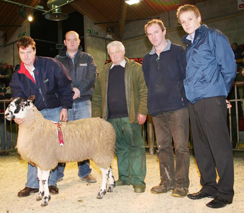 Robin Booth is pictured with the Skipton charity show champion, joined by, from left, sponsor Chris Pearson, Pearson Farm Supplies, the two principal bidders Les Thackray and James Bracewell, and Manorlands fundraiser Chris Normington.