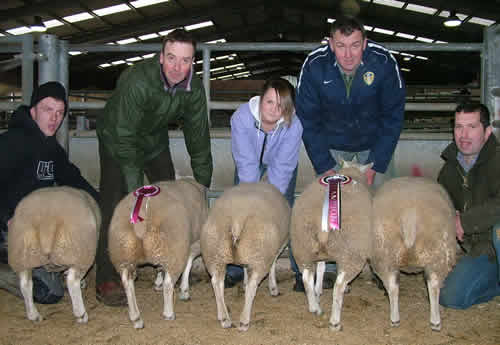 John Garnett (second from left), prime lambs show judge Nick Dalby (second from right) and handlers with John’s champion pen of Beltex-cross prime lambs