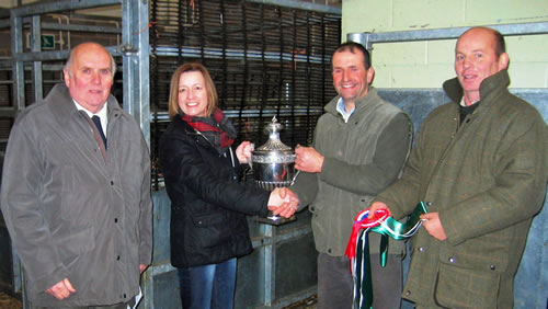 Andrew Shakeshaft (second from right) receives the dairy champion’s trophy from Christine Banks of Santander watched by co-sponsor Peter Phillips of Blue Merle (left) and judge Anthony Mathews