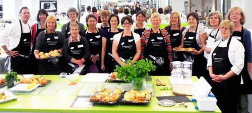 Farm Stay Yorkshire ladies are pictured with their hosts in the Dean Clough Cooking School kitchen.