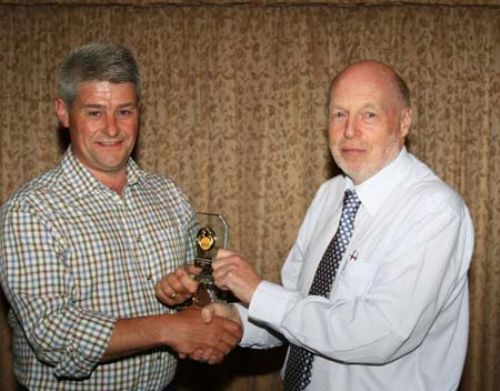 Neville Green being presented with his Award by Jim Burling