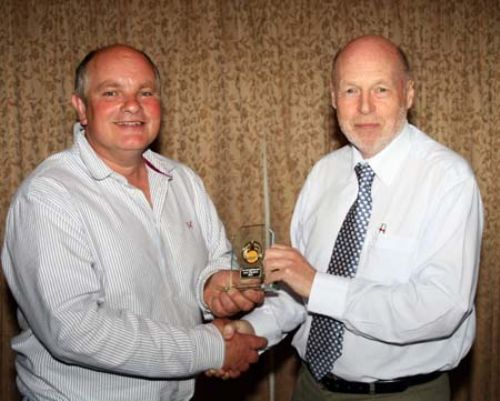 William Crosse being presented with his award by Jim Burling