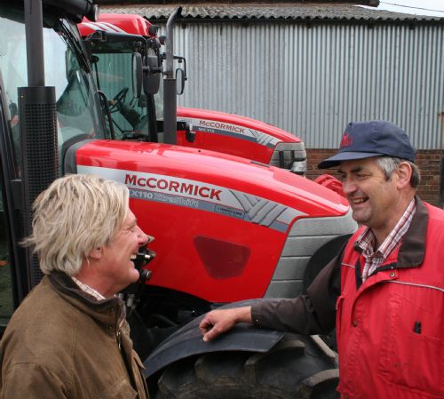 Will Charnley (left) of John Charnley & Sons with dairy farmer David Lomas and two of his McCormick tractors – a 112hp MC115 and the 100th McCormick supplied by Charnleys, a 100hp CX110 XtraShift.