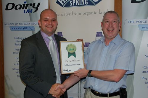 David Watson on the left receiving a certificate from Edmund Proffitt of Dairy UK 