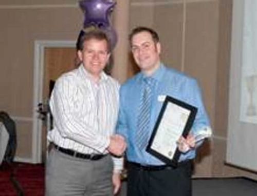 Richard Heppleston receives his award from William Burgess