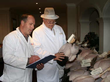 Show organiser Paul Fields [left] with ATA president Derek Kelly judging the entries