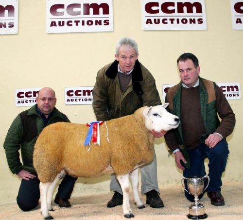 Stuart Currie, centre, with his 2011 Skipton Winter Texel supreme champion, joined by sponsor Richard Harrison, left, and judge David Burkill