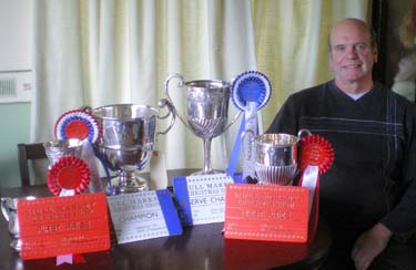Ian Broumpton with the haul of silverware which he won at Hull Market Christmas Fatstock Show