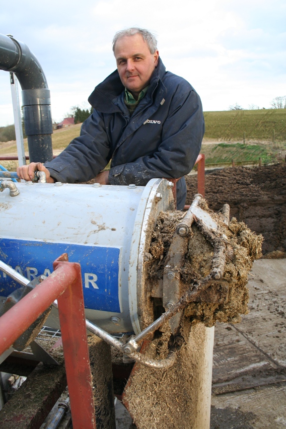 Neil Harrison with the FAN separator. Friction between the solids plug and cylindrical mouth-piece of the FAN separator, together with the adjustable weighted outlet flaps, create counter-pressure for forced de-watering.
