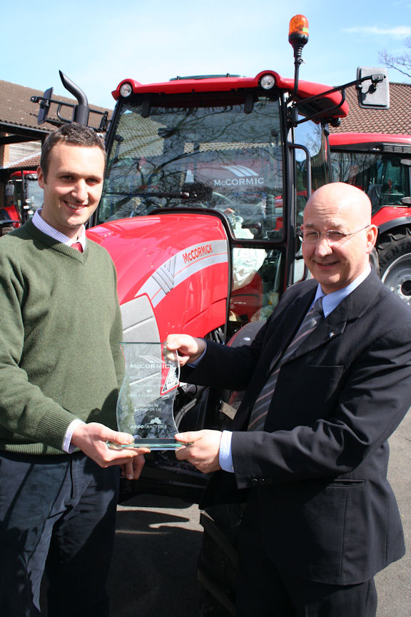 Robert Crawdford (left) receives the McCormick National Dealer of the Year award from Ray Spinks, general manager, AgriArgo UK.