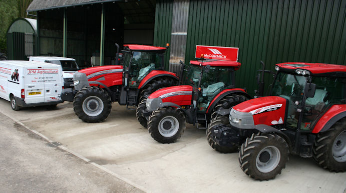 A line-up of McCormick tractors outside the workshops, parts store and new retail area at JPM Agricultural