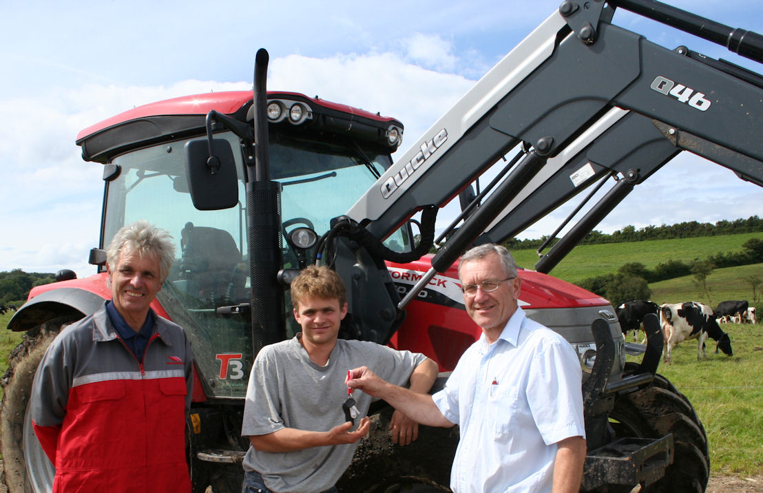 Brian Yeates (right) and Richard Read of Read Agriservices present first McCormick customer Nick Hutton with the keys to the new McCormick X60 tractor he and his brother Ben have put to work on their 280-cow dairy enterprise.