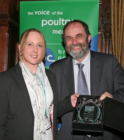 Farming Minister David Heath (right) presents Rachel Almey with her engraved trophy as winner of the Pfizer Trainee of the Year Award
