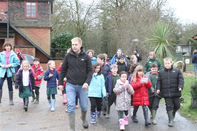 Woodland Farm Trust project manager David Jones leads pupils on their tour of the farm.