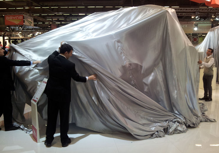 Off come the covers – members of the design and engineering team pull off the sheets…..