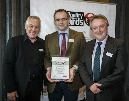 Paul Kelly [left] and Philip Regan [right] of Kelly Turkeys receive the award from Andrew Loftus of Morrison’s Supermarkets