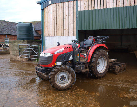 A 54hp McCormick X10.55M in typical yard scraping guise on a dairy farm. 