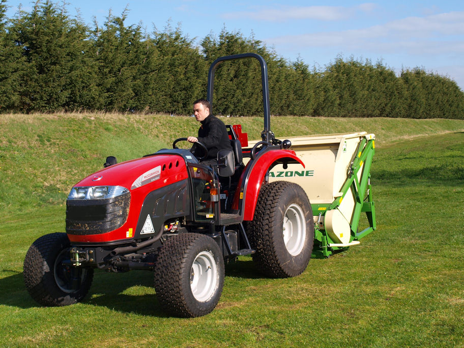 A 54hp McCormick X10.55M with 12x12 transmission operating a flail mower-collector.