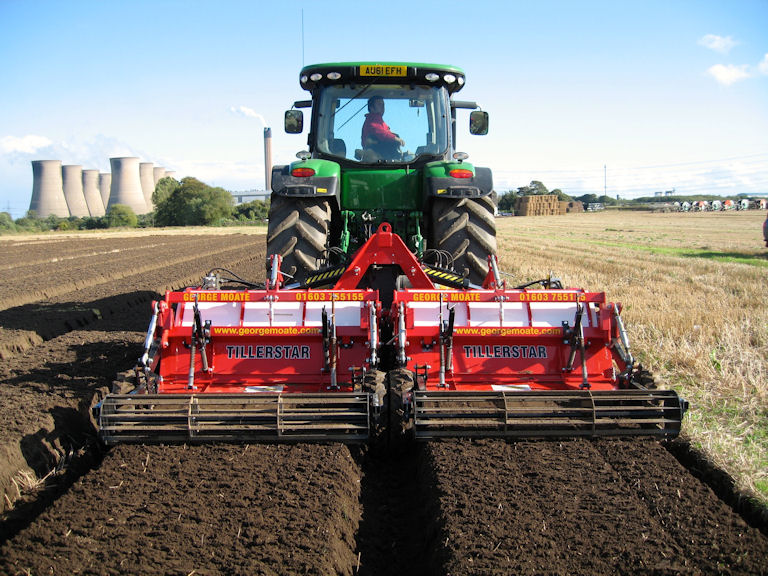At work: A two-bed version of the George Moate Tillerstar one-pass tilling, bed forming and stone separating machine.