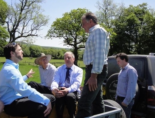 Crabb visit trailer: Farmer Wyn Jones (standing) discussing agricultural issues with FUW finance and organisation committee south Wales member Brian Thomas (centre) and Preseli Pembrokeshire MP Stephen Crabb.