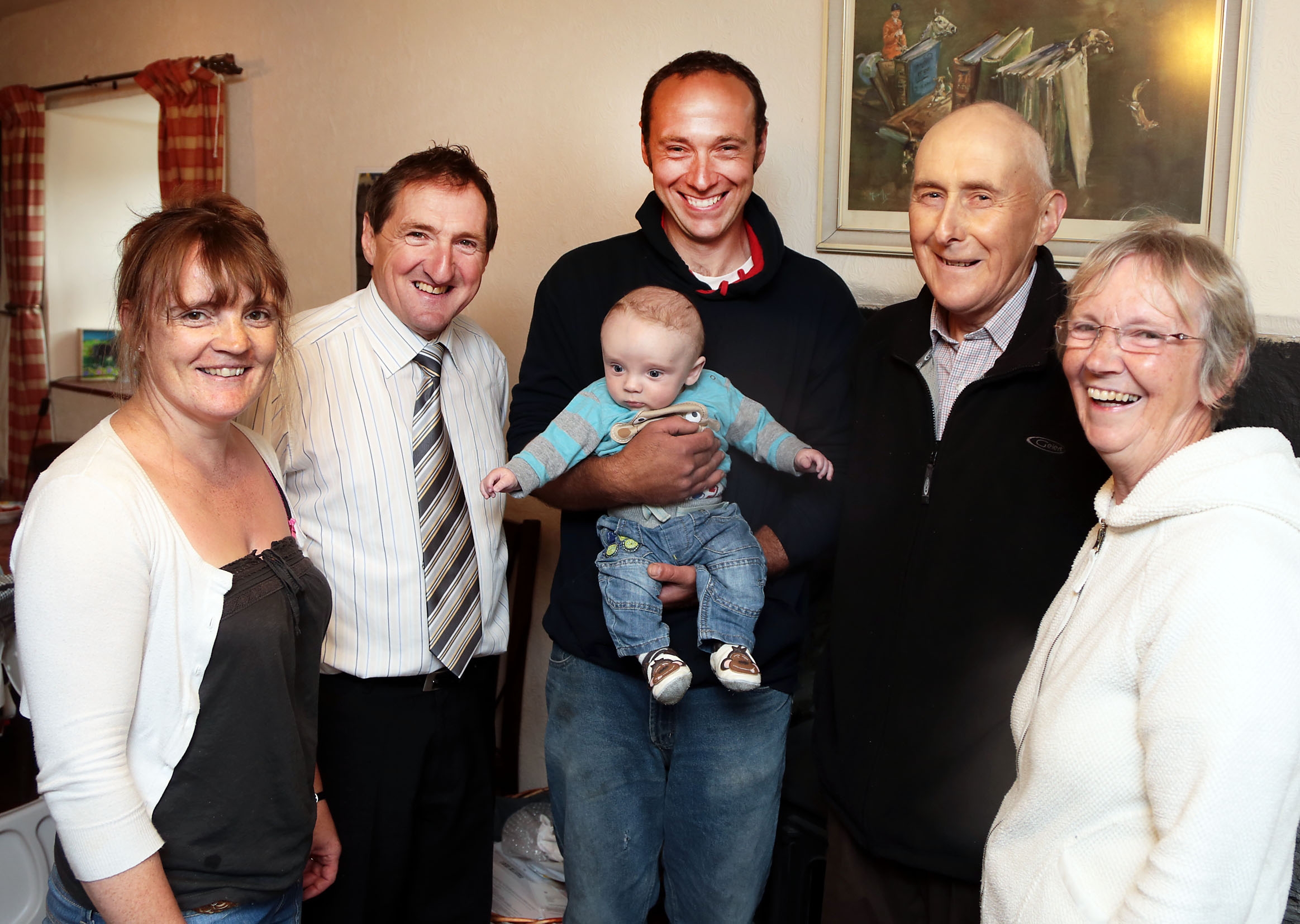 The Pughe family with Emyr Jones. From left - Eleri, Dilwyn with baby Elgan, John and Meirwen.  