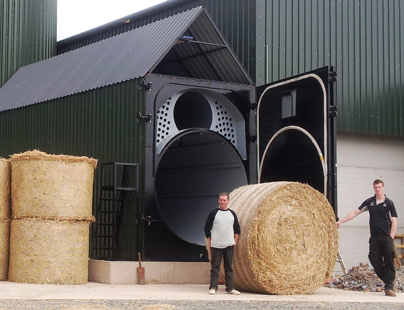 The larger bale in front of the Topling Big Straw Boiler, with the original bales to the left