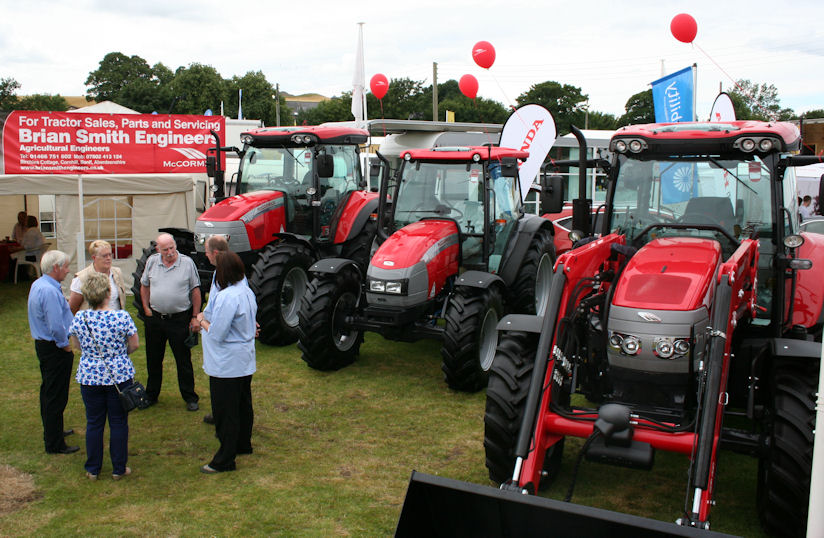A 92-121hp McCormick X60 with LiftMaster loader displayed at the Turriff Show alongside an 83-102hp C-Max and 102-126hp McCormick MC.