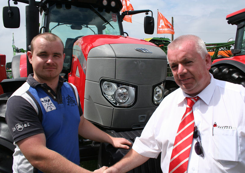 It’s a deal! Carwyn Williams (right), HJR Agri’s new man in north Wales, with Gethin Vaughan of D Vaughan & Son in front of a McCormick MTX150 tractor of the type now being operated by the Denbigh-based contractor.