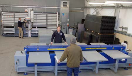 Quality Equipment’s new plastic panel welding machine (foreground), with the new sawing equipment in the background. They will allow a three-fold increase in output
