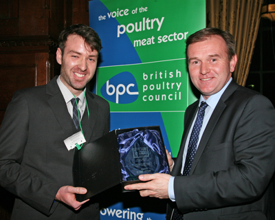 Nicholas Ham receiving the award for the Zoetis / British Poultry Council Trainee of the Year from Farming Minister George Eustice at the House of Commons