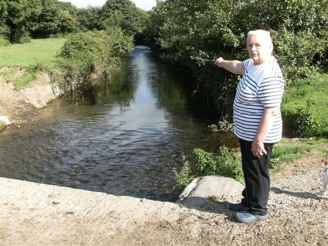 Beatrice Hayball-Jones alongside the section of river that runs through her farm at Treoes in the Vale of Glamorgan.