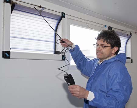 Tim Miller, ARM’s environment specialist, checks an air inlet with an anemometer, as part of the new annual ‘MOT’ service for ARM piggeries