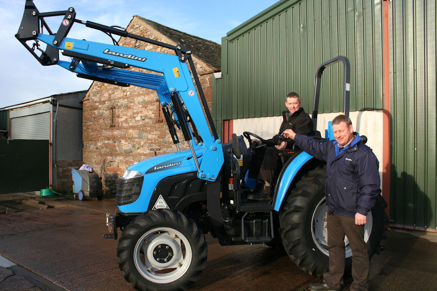 Tony Blackburn of Newton Trailer Centre (right) hands over the keys for the new Landini 1-55M tractor to Buttermere sheep farmer Alan Beard.