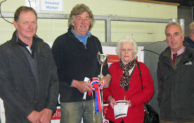 Robin Maund Cup winner Martin Jones (second from left) pictured with (from left) judge Adrian Jones, cup donor Barbara Maund and Halls’ director and dairy specialist David Giles.