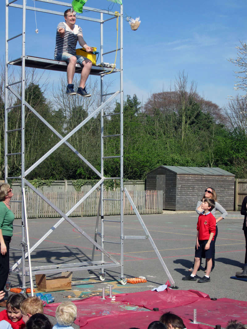 Children made parachutes for eggs which were dropped from a scaffold to see if they would survive the fall.