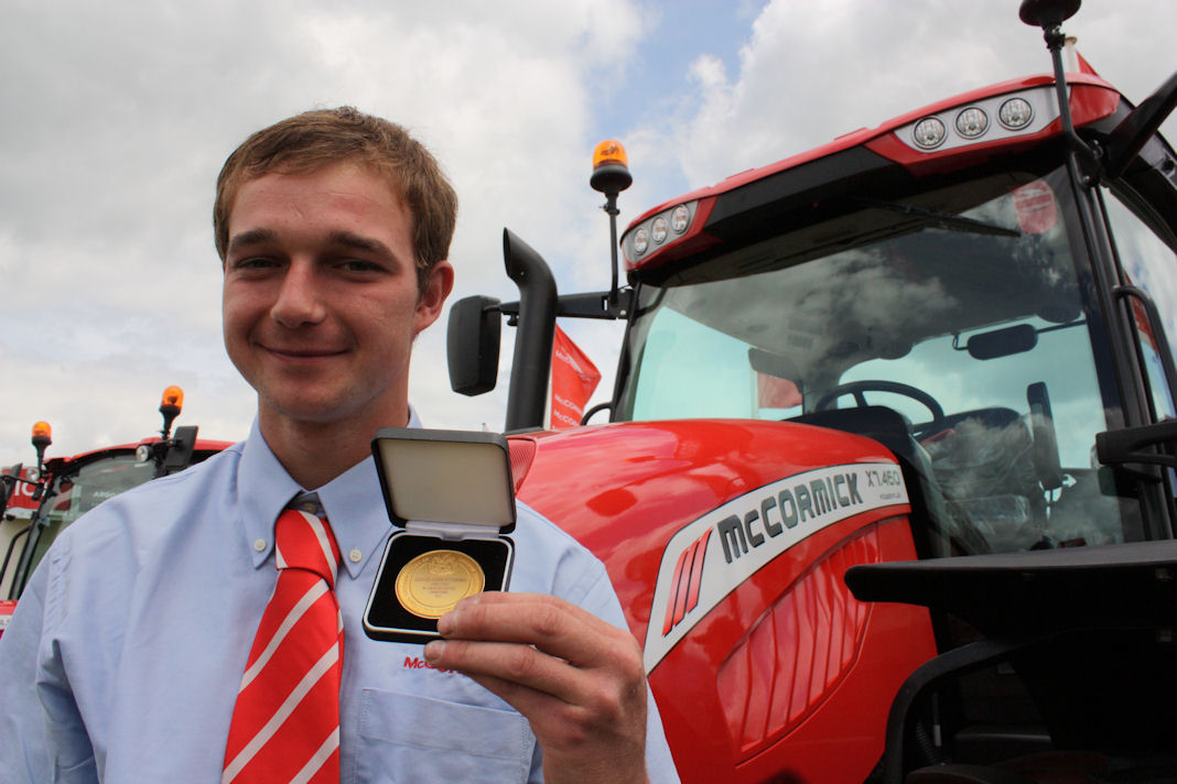 Charles Downing proudly shows off the Gold Medal award he received as worldwide top student on his City & Guilds Land Based Service Engineering course.
