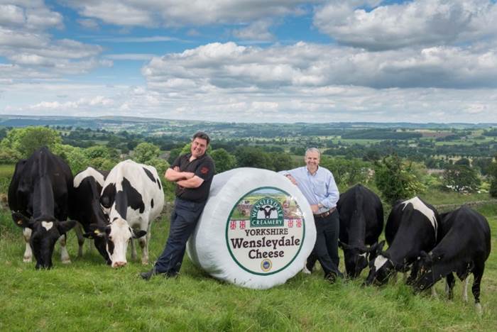 Wensleydale dairy farmer Kevin Clarkson (Left) and Wensleydale MD David Hartley (right) celebrate Le Grand Fromage! 