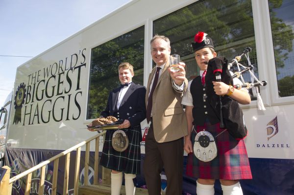 15-year-old Cameron Hill from Kilmarnock, who addressed the record-breaking haggis, is joined by Cabinet Secretary for Rural Affairs and Food, Richard Lochhead, and piper, Cameron Forrest, 14, from Biggar. 