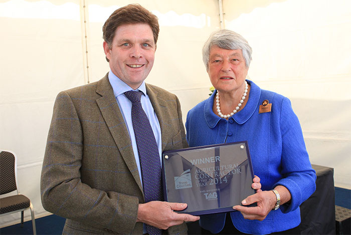 Dame Janet Trotter DBE HML presents the award to Patrick Gething Lewis of Gamber Cleaning Services