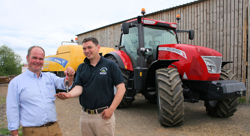 Warwickshire contractor Duncan Hawley collects the keys to his new McCormick X7.680 Pro Drive from Charlie Rollason of Moreton Morrell-based McCormick dealer Rollason Engineering.