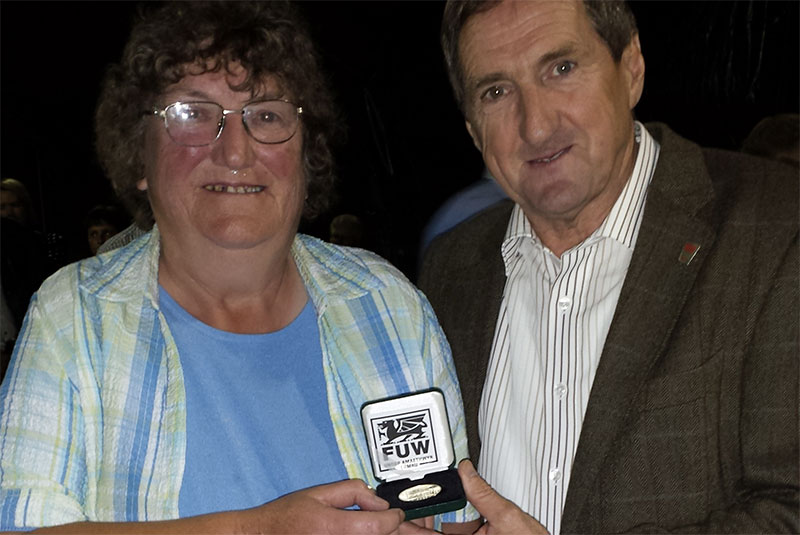 Presenting the FUW's gold medal for services to the union and agricultural in Wales to Miss Howells is FUW president Emyr Jones