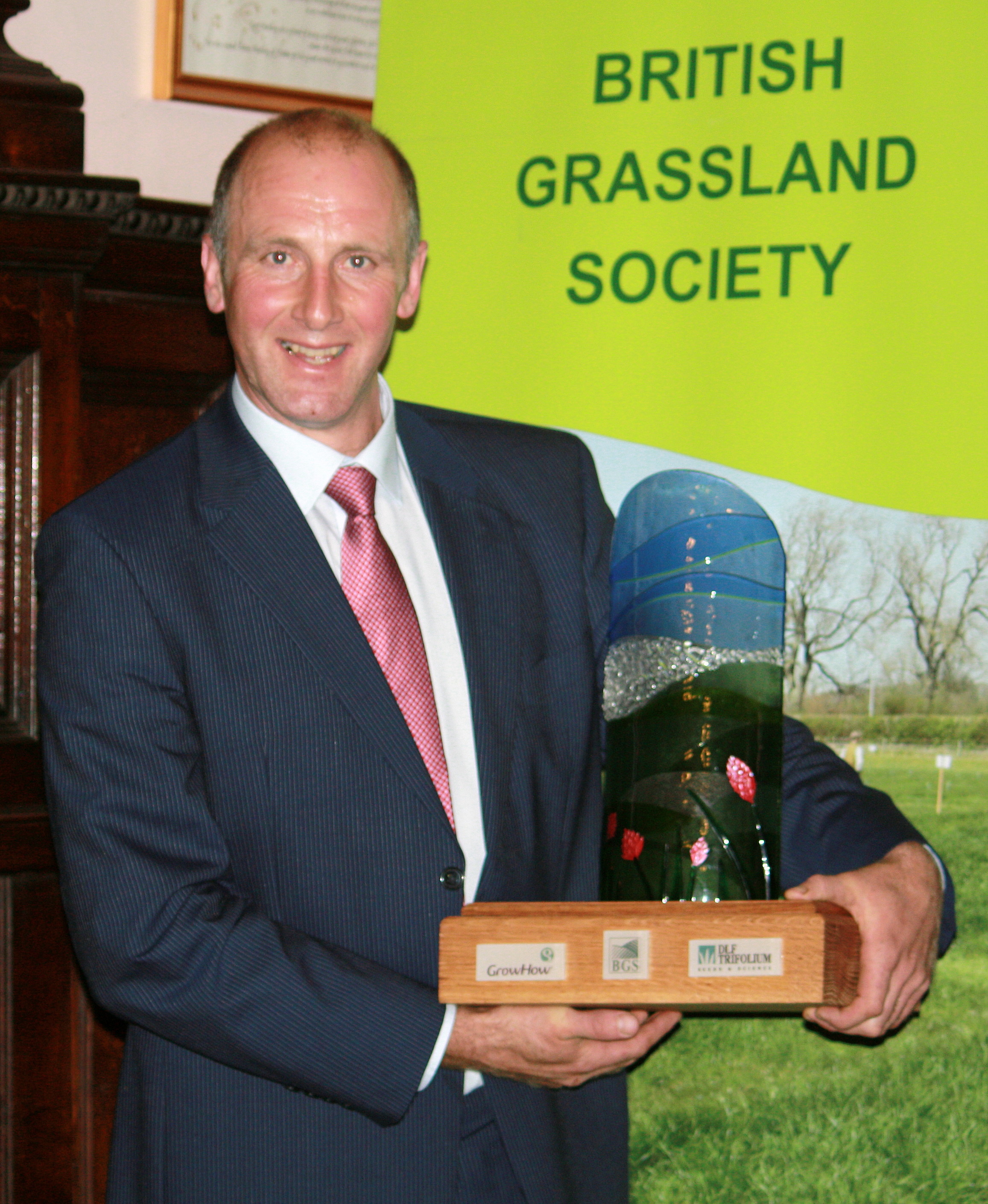 UK wide Grassland Competition winner Dafydd Jones with the prestigious award