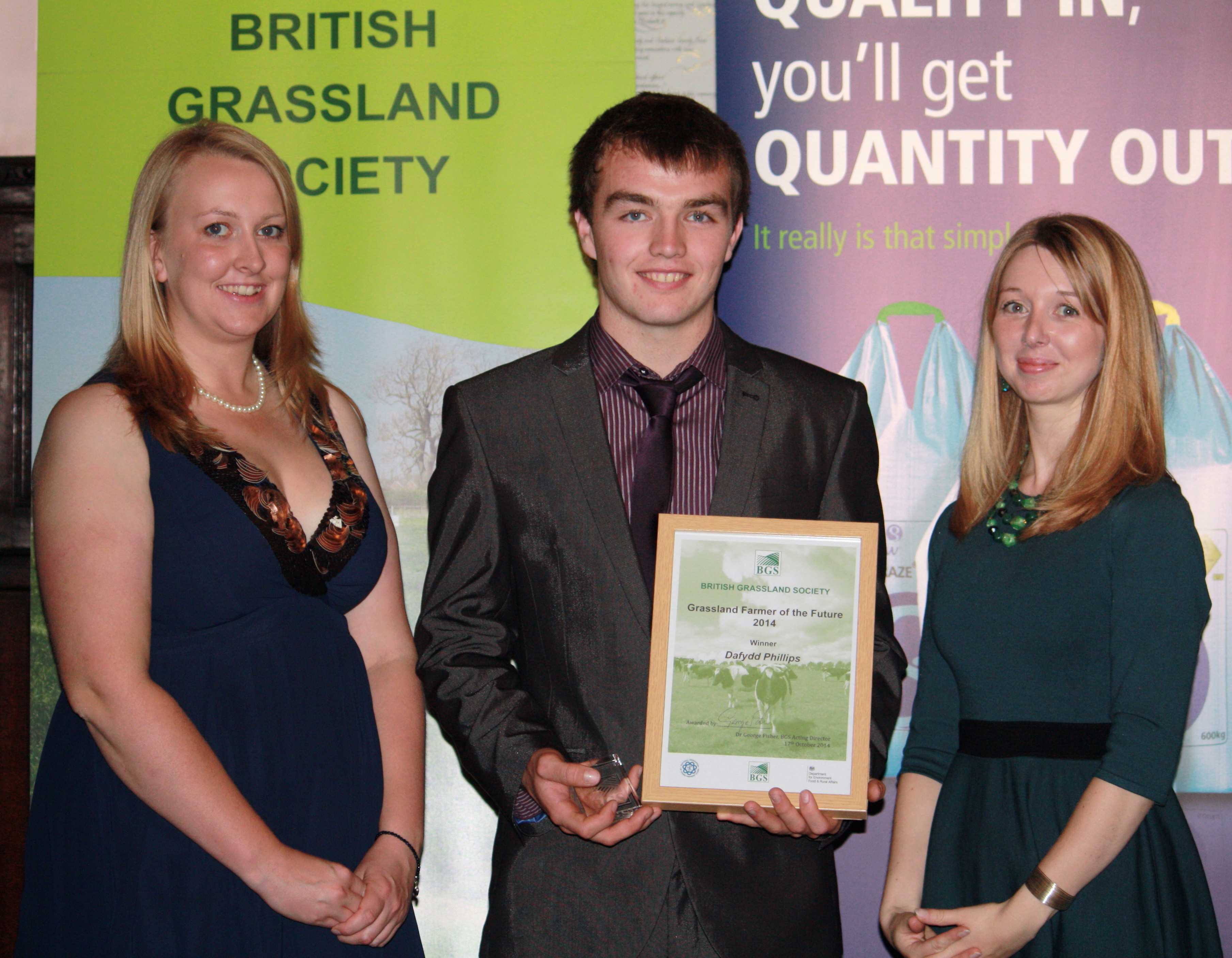 Young Grassland competition winner Dafydd Phillips with Jo Wyles, NFYFC left and Charlotte Evans, BGS right