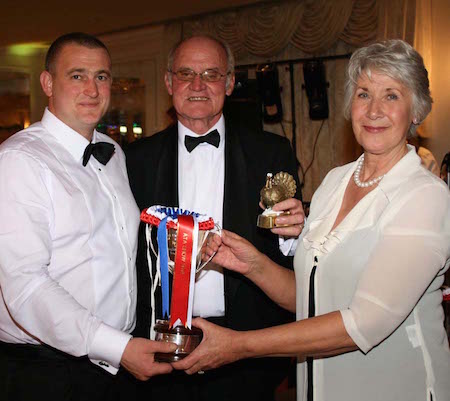 (left) Jody Baxter, Cottage Farm Turkeys receiving his award for Best in Show from Barbara and Danny Rowe, show judges