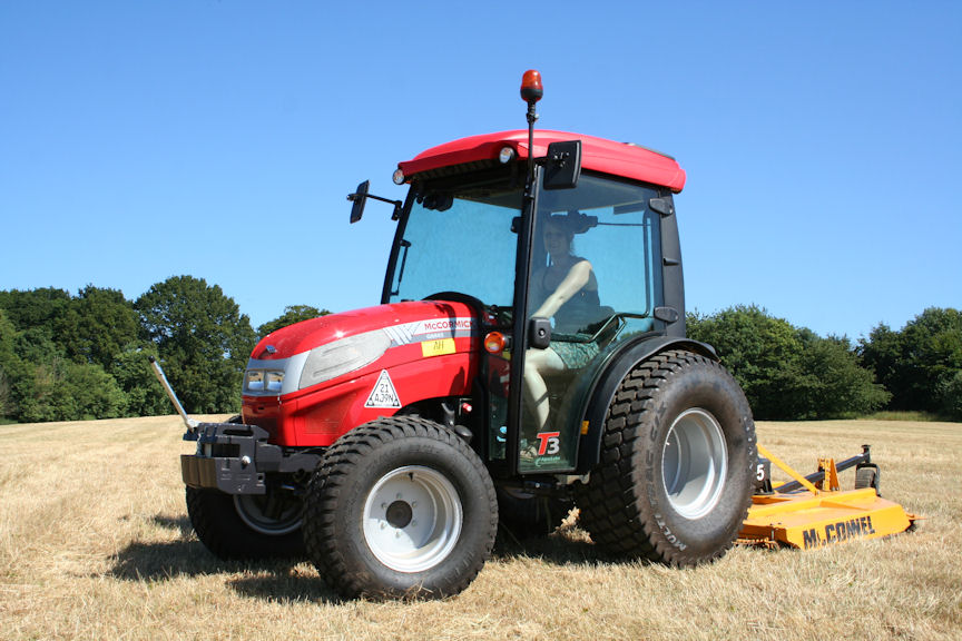 Victoria Elkin driving the tractor purchased to help prepare and maintain the property.