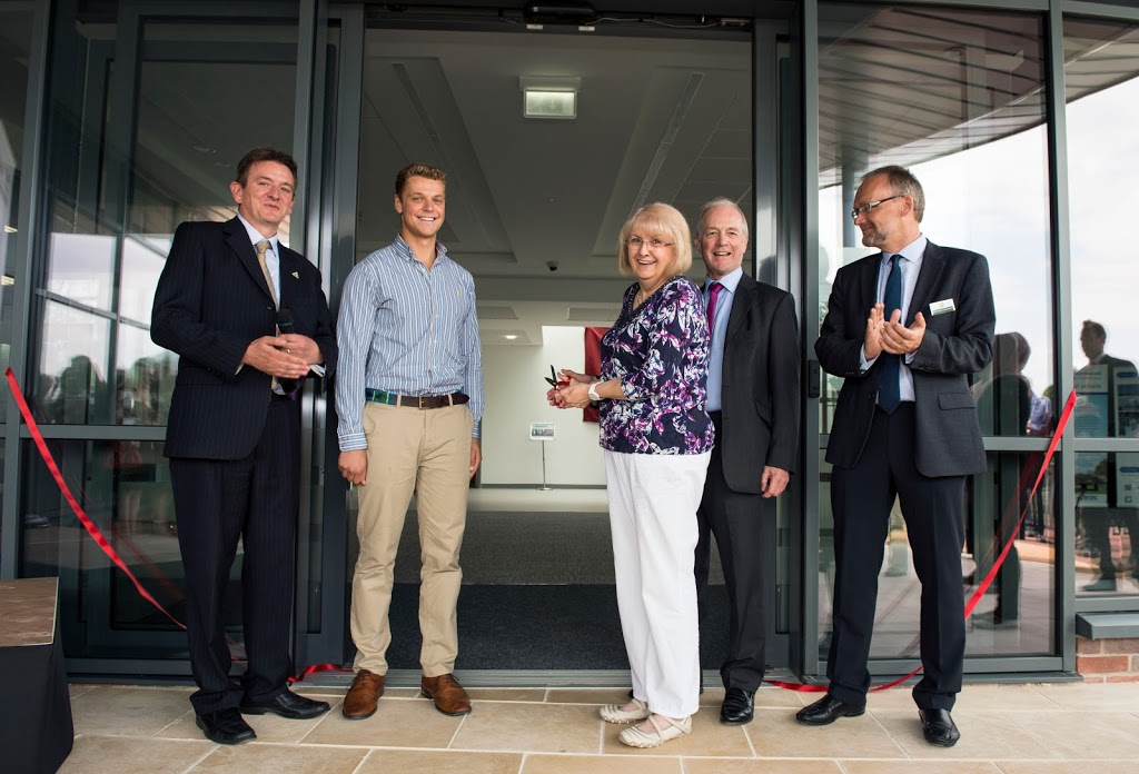 The ribbon is cut, people from left Chris Dunkley (Chief Executive), Chris Till (PhD student) Denise Legg (Current employee of Rothamsted Research), Rt Hon Peter Lilley (MP for Hitchin & Harpenden) Prof Achim Doberman (Director Rothamsted Research)