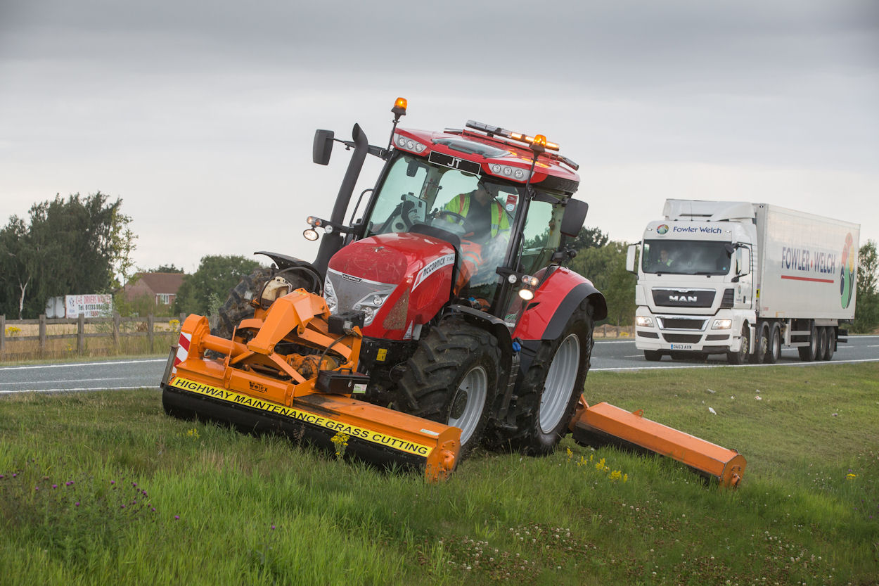 Front- and rear-mounted flail mowers get the job done; note extra safety lights. 